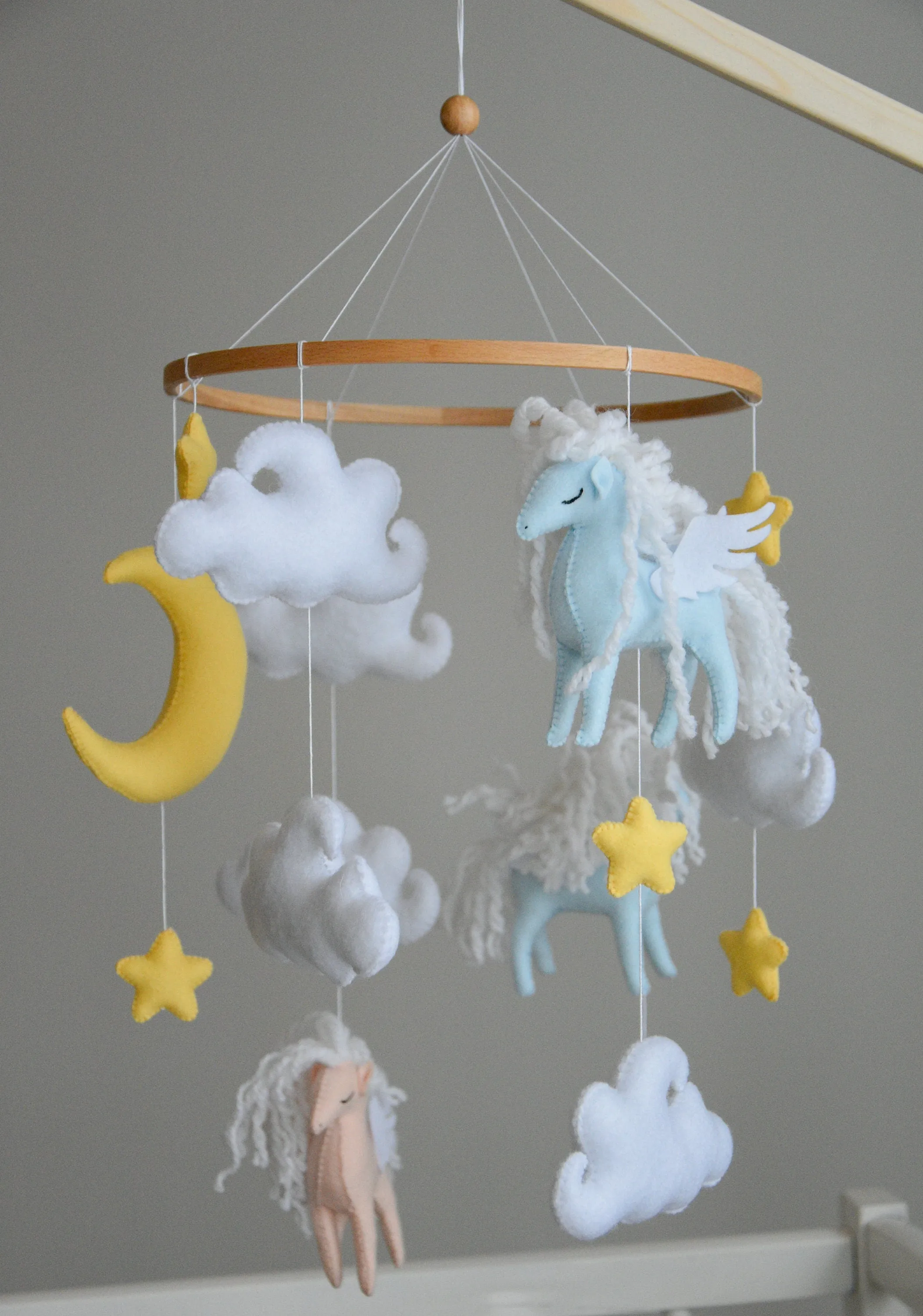 Horse mobile with clouds and pale yellow stars