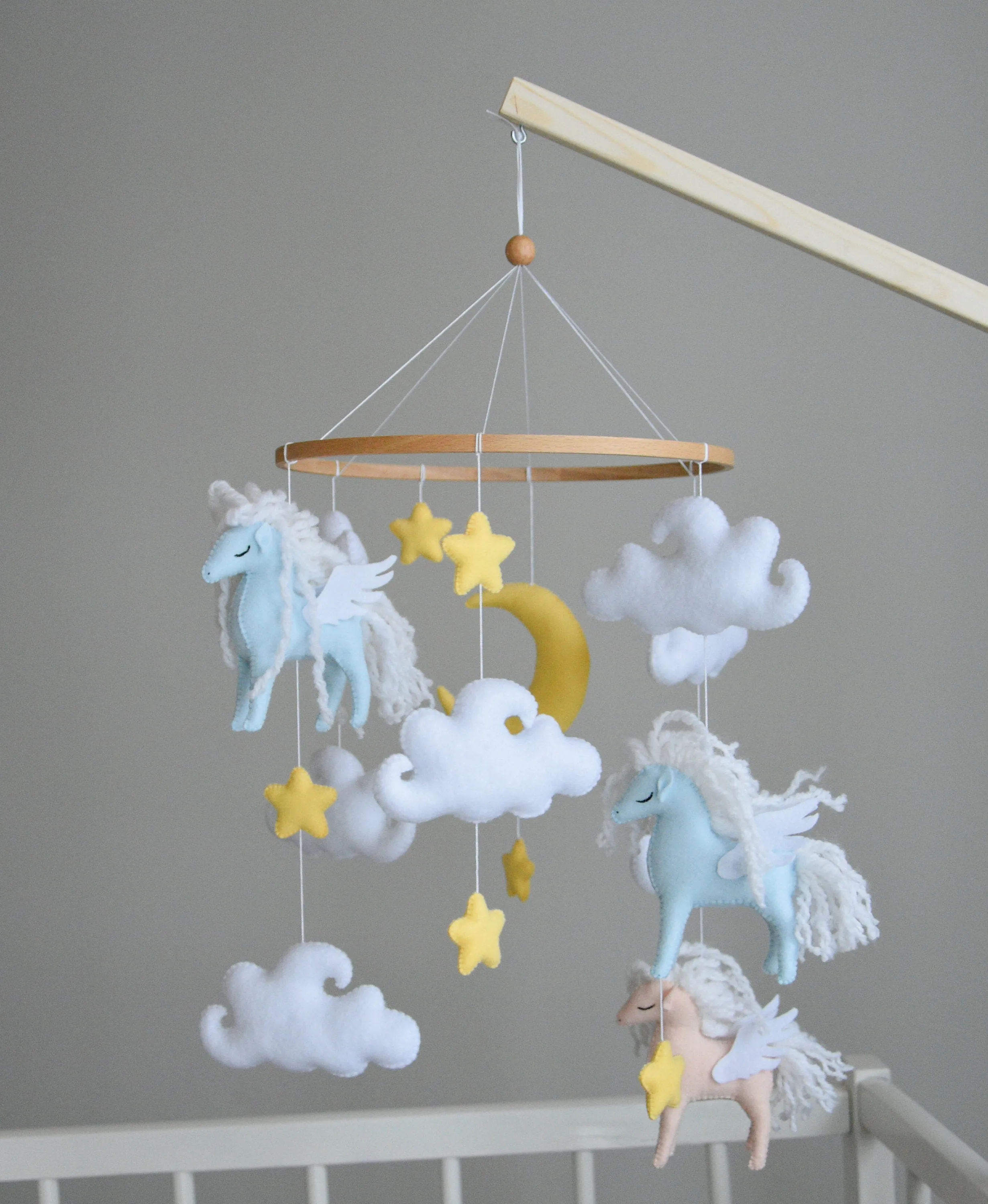 Horse mobile with clouds and pale yellow stars