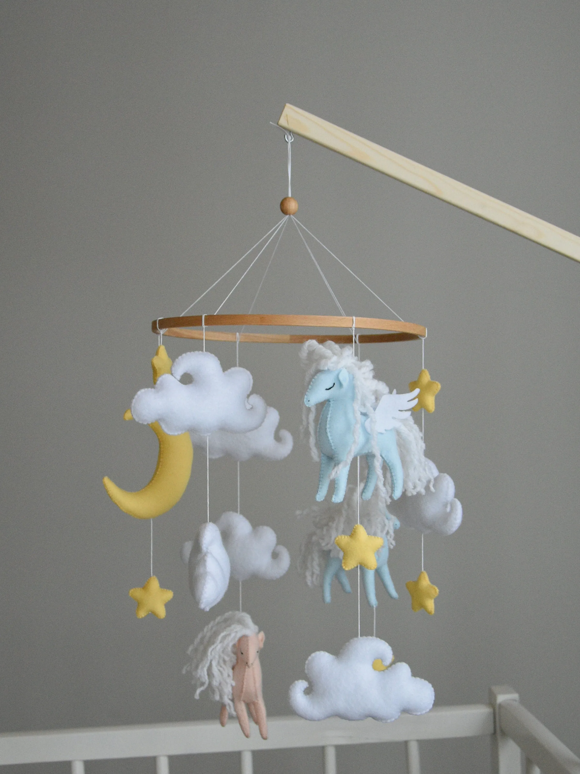 Horse mobile with clouds and pale yellow stars