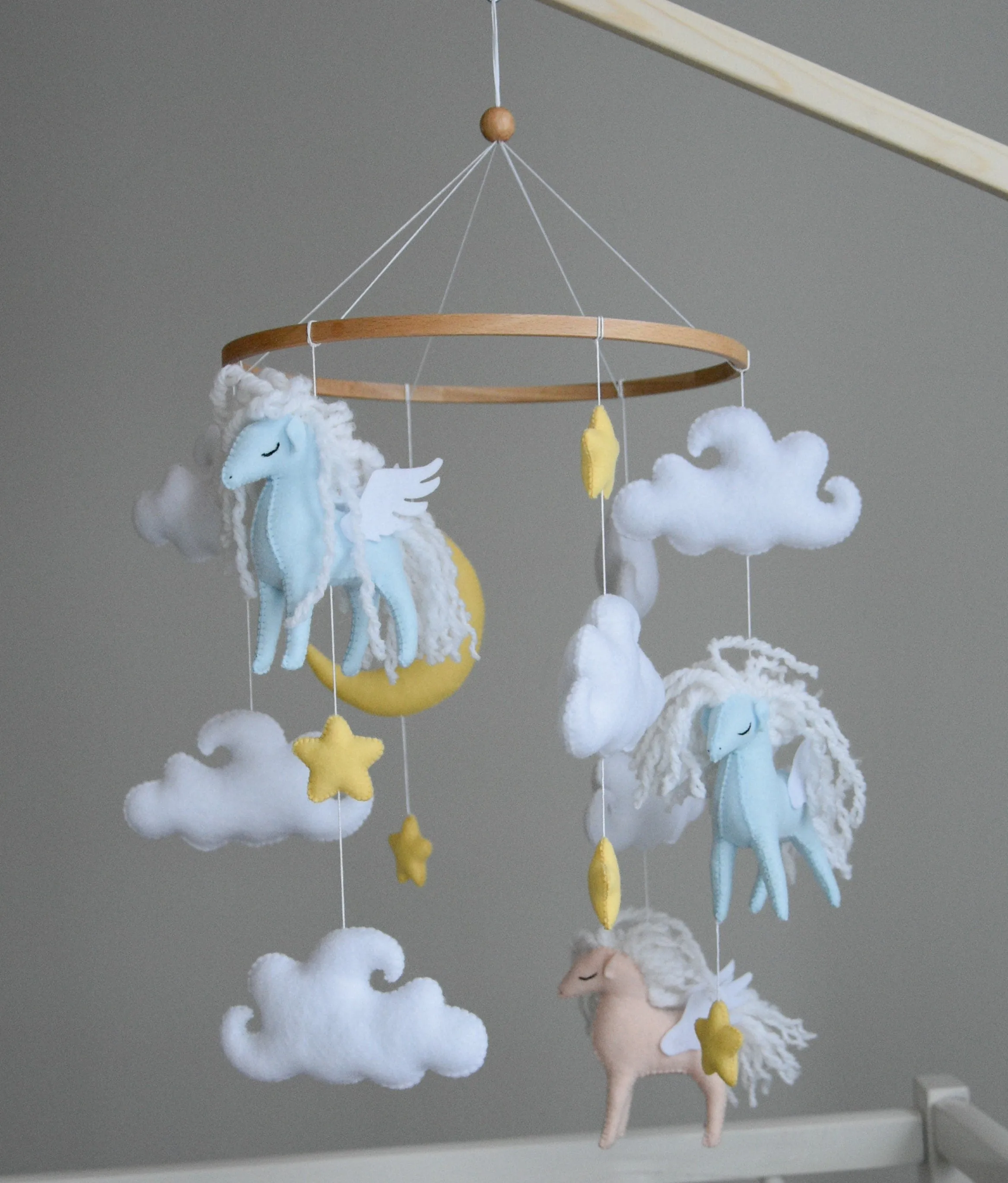 Horse mobile with clouds and pale yellow stars