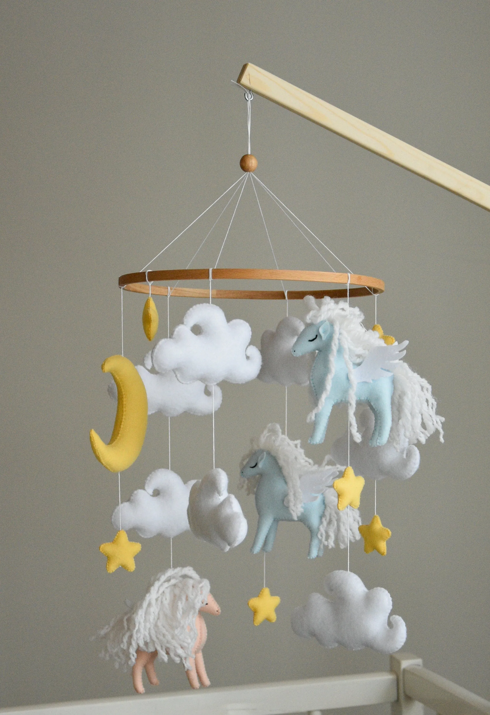 Horse mobile with clouds and pale yellow stars