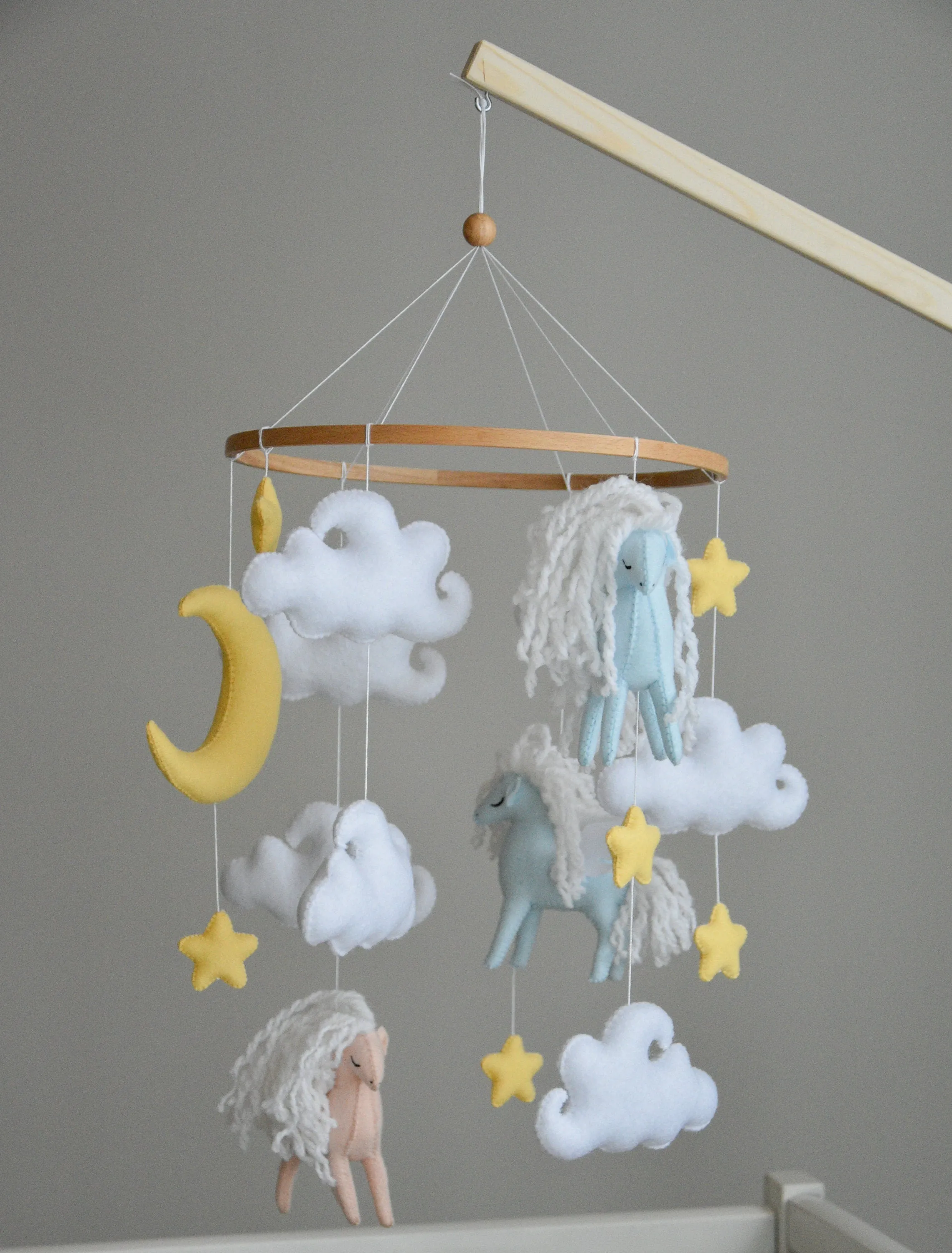 Horse mobile with clouds and pale yellow stars